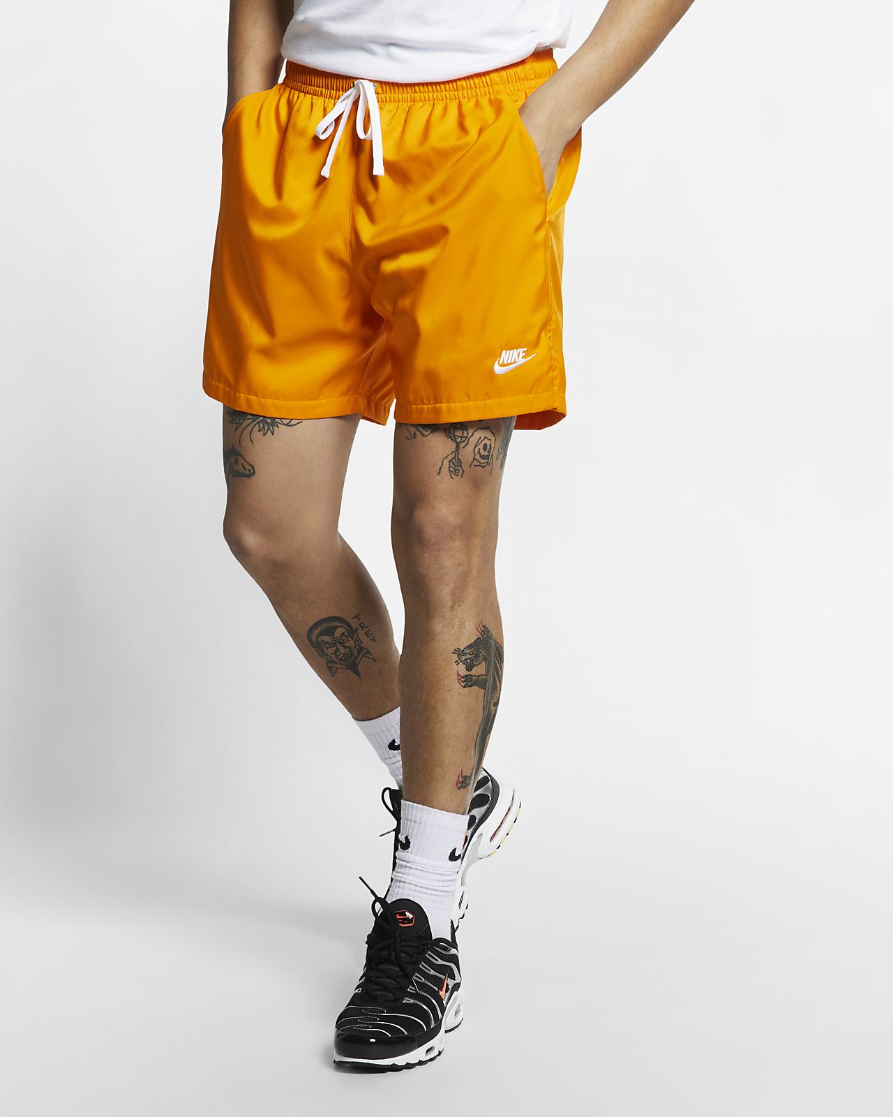 men orange nike shorts