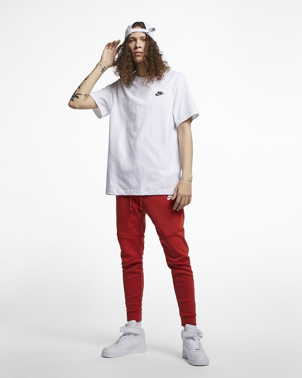 white nike shirt with red swoosh