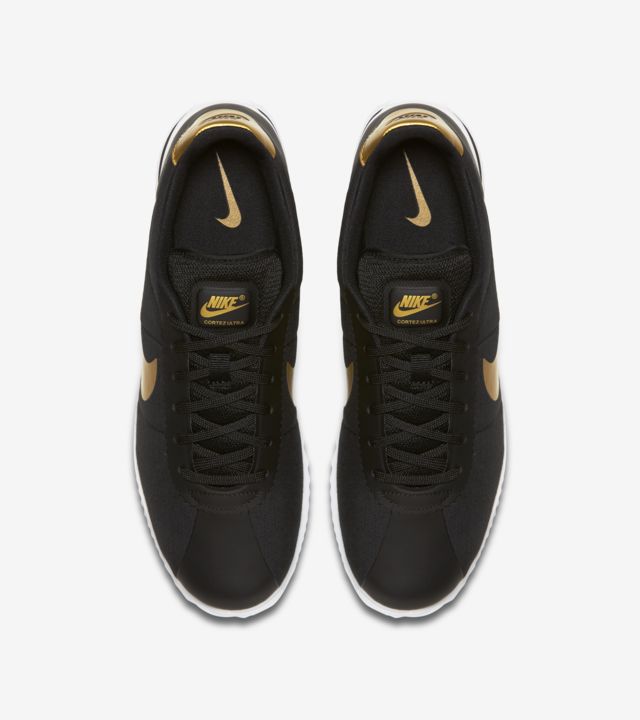 rose gold and black nike cortez