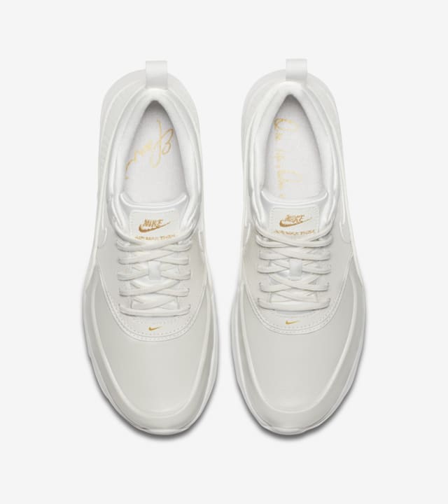 nike thea white and gold