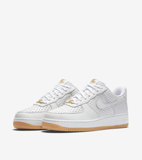 women's white and gold air force 1