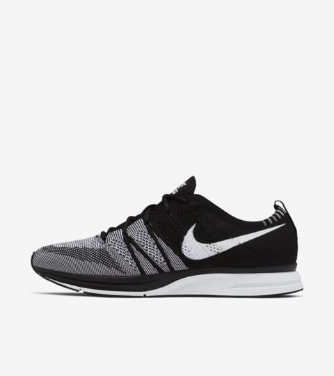 flyknit trainer black white