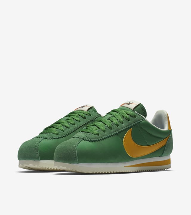green and yellow nike shoes