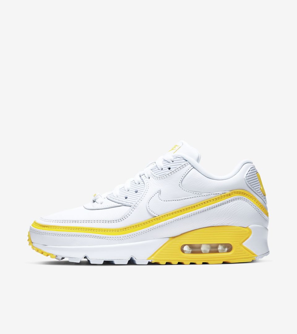 yellow and white nike sneakers