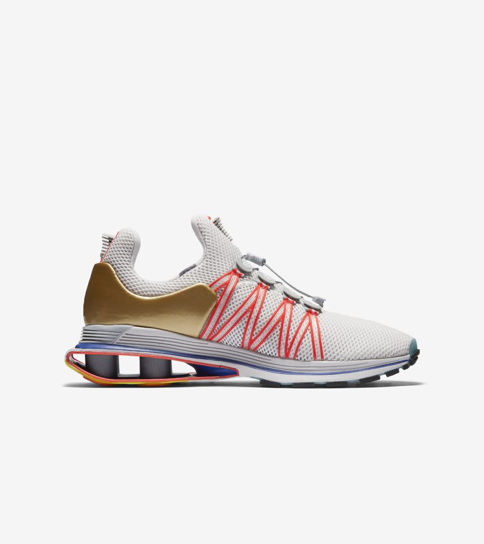 nike shox gravity women's gold