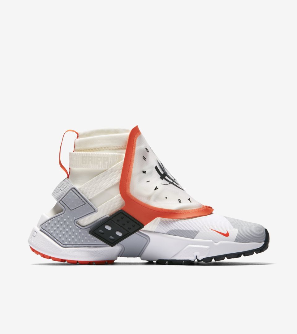 nike air huarache trainers in sail cream and orange