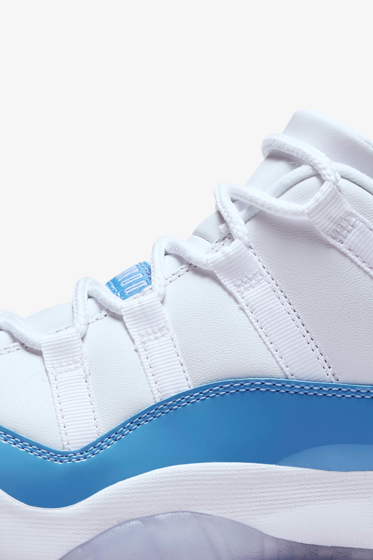 Air Jordan 11 Retro Low 'White & University Blue'. Nike⁠+ SNKRS