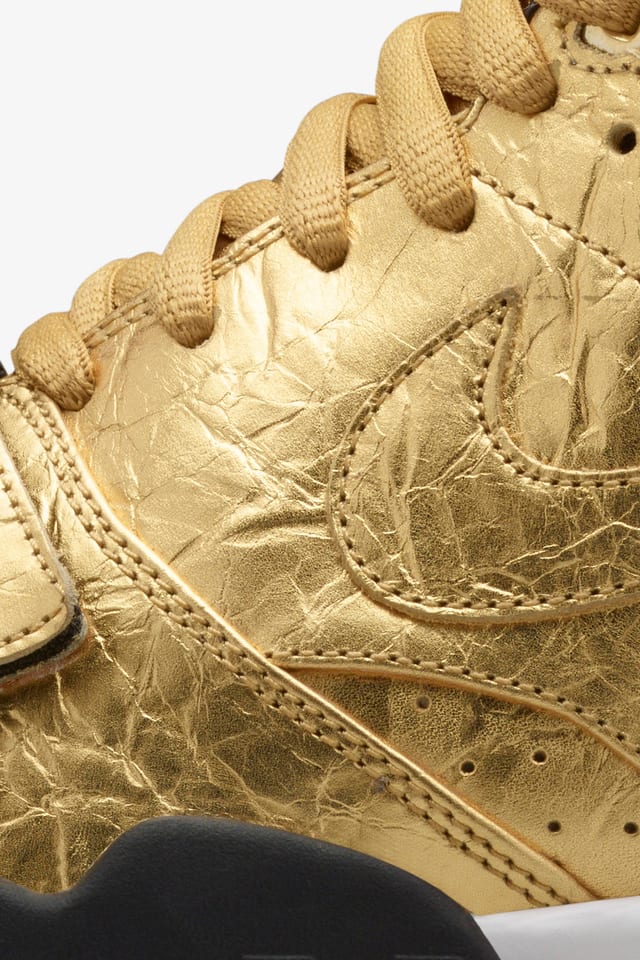 gold trainers nike